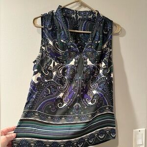 Paisley sleeveless blouse with zip up side. Sizing M-L. See description